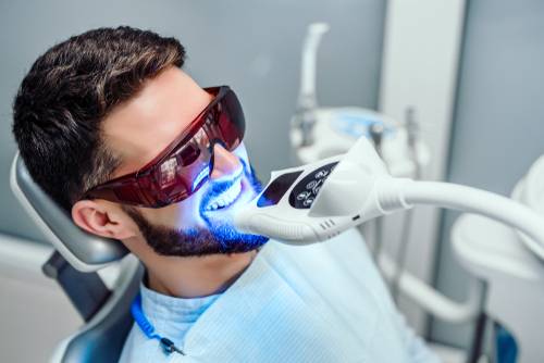 A male patient getting in-office teeth whitening in Chicago, IL